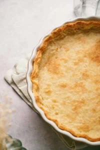 A delicious homemade pie crust in a pie dish.