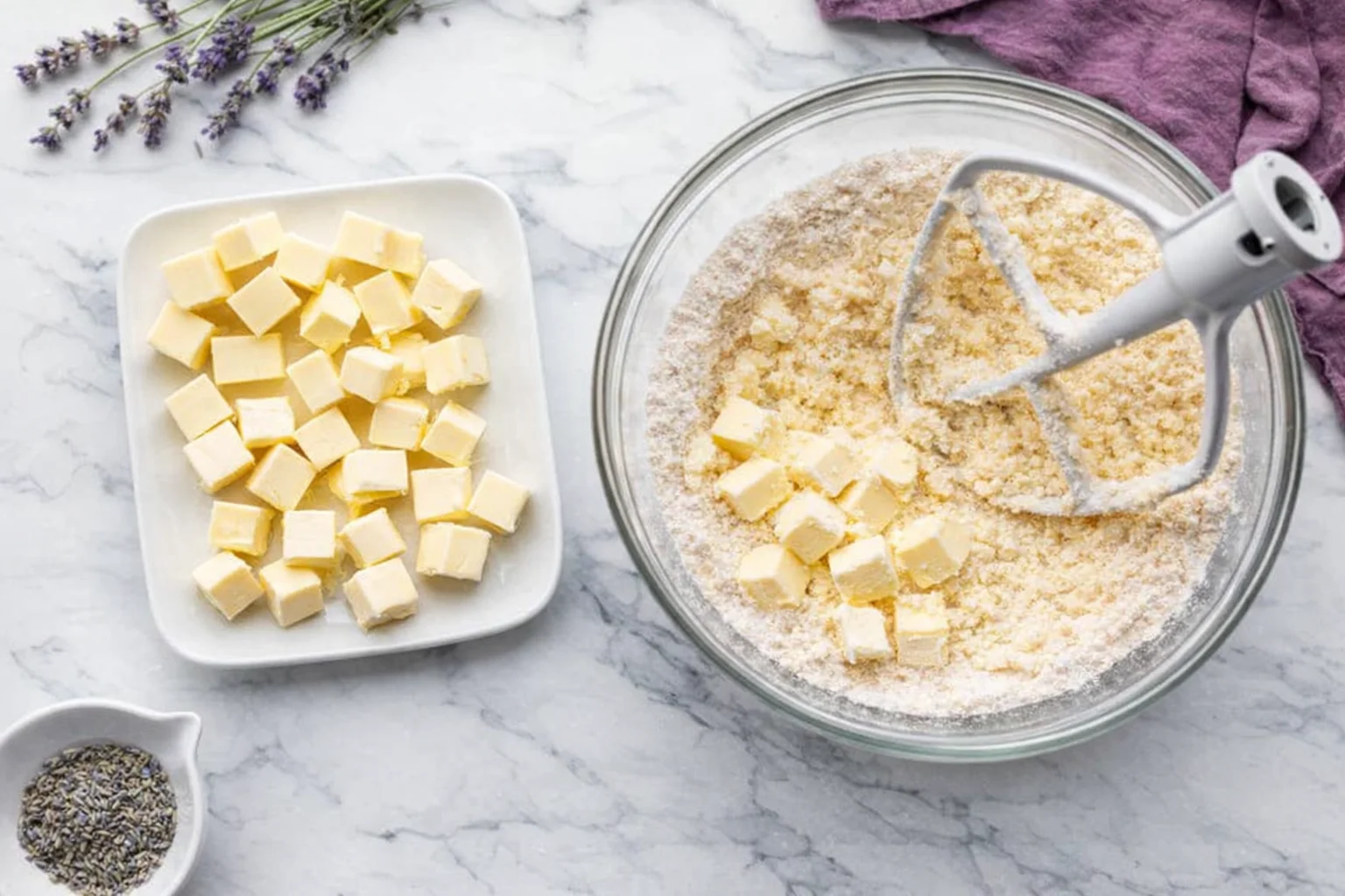 step-process-placeholder-5-6.png Cubed butter added to dry ingredients in bowl, being mixed until coarse crumbs form