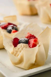 A mini berry tartlet with a spring roll wrapper.