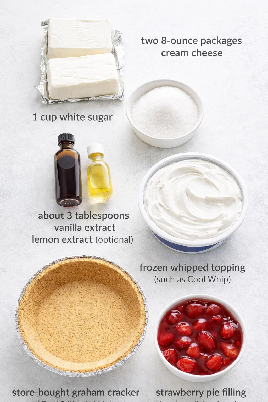 Measured ingredients arranged for No-Bake Cheesecake with Cool Whip: two 8-ounce packages of cream cheese, One cup of white sugar, About 3 tablespoons vanilla extract, Lemon extract (optional), A container of frozen whip