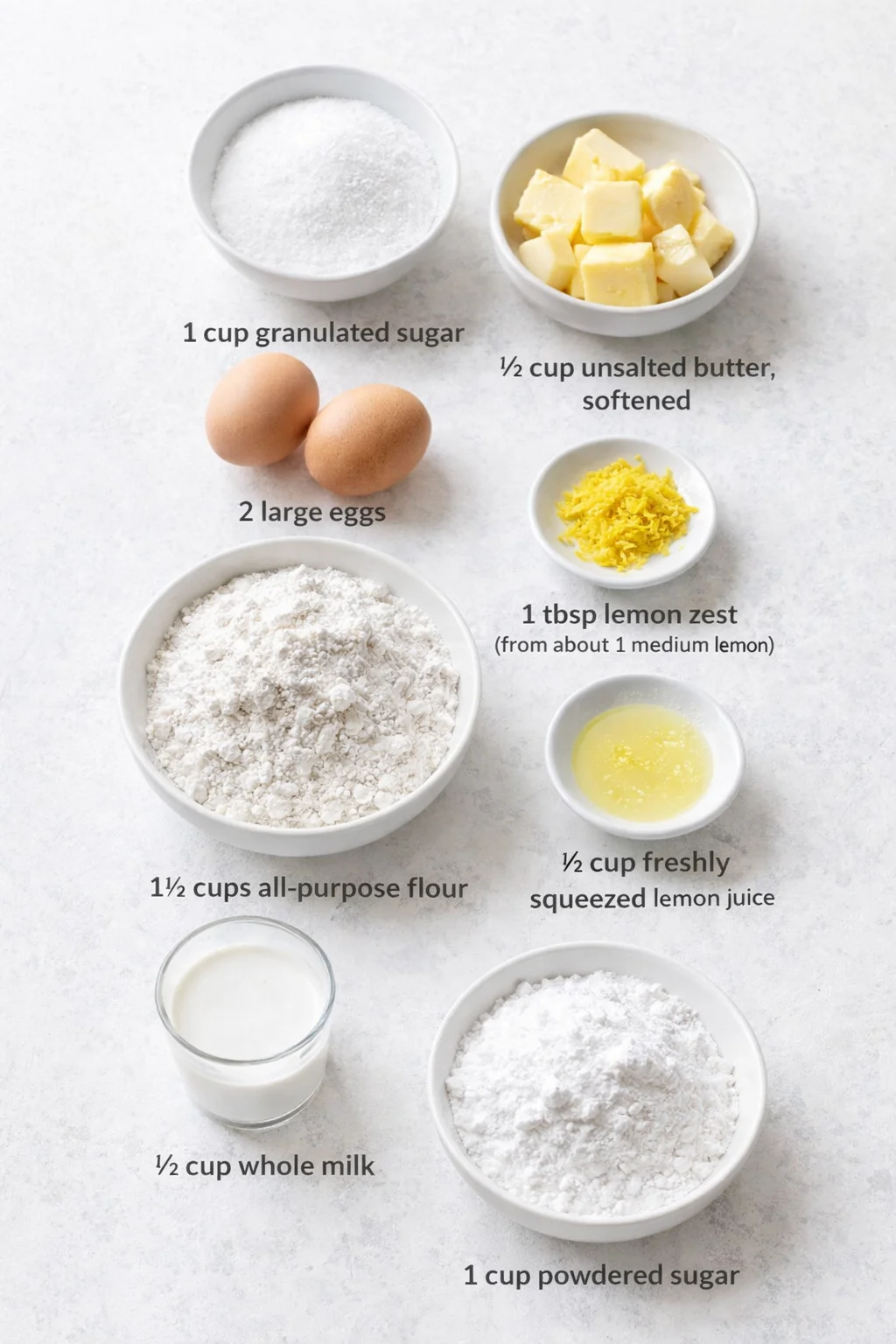 Measured ingredients arranged for Paul Hollywood’s Favorite One-Bowl Lemon Dessert: 1 cup granulated sugar, ½ cup unsalted butter, softened to room temperature, 2 large eggs, 1 tablespoon lemon zest (from about 1 medium 