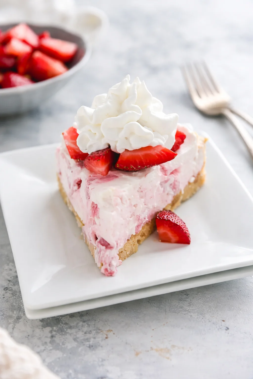 Final plated No-Bake Strawberry Cheesecake served as a hero shot