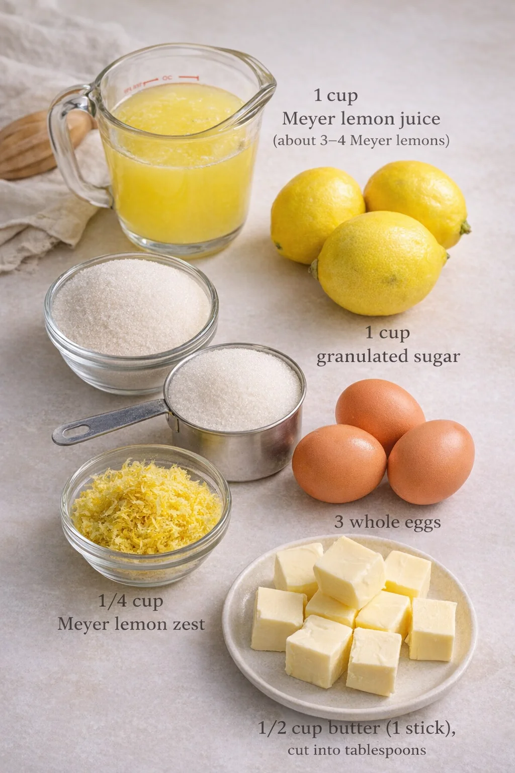 Measured ingredients arranged for Easy Meyer Lemon Curd {using the whole egg}: 1 cup Meyer lemon juice (about 3–4 Meyer lemons), 1 cup granulated sugar, 1/4 cup Meyer lemon zest, 3 whole eggs, 1/2 cup butter (1 stick), c