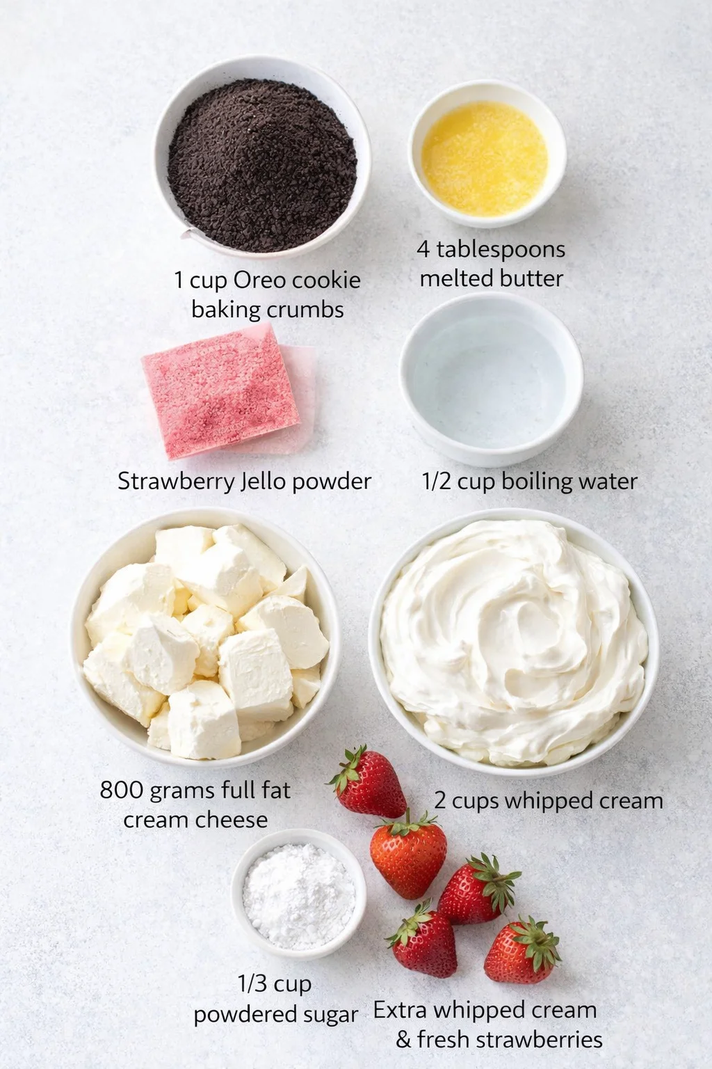 Measured ingredients arranged for Easy No Bake Strawberry Cheesecake: 1 cup Oreo cookie baking crumbs, 4 tablespoons melted butter, 1 85 gram box of strawberry-flavored Jello powder, 1/2 cup boiling water, 800 grams full