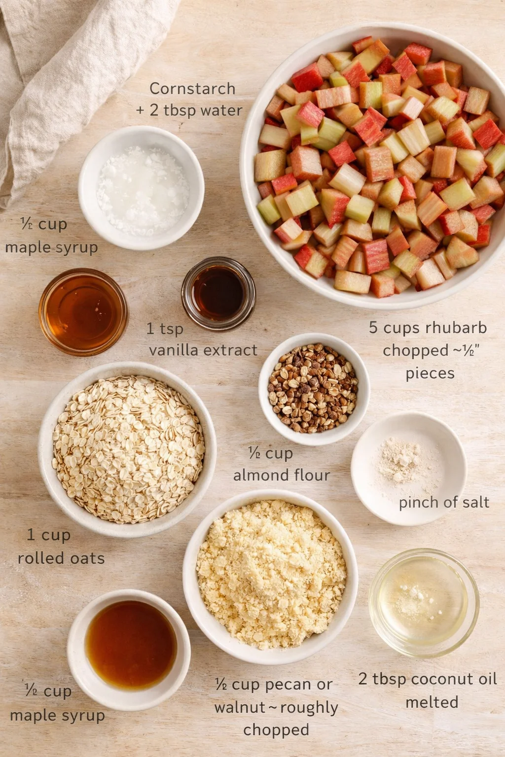 Measured ingredients arranged for Vegan Rhubarb Crumble (Gluten-Free) - Plant Based Jess: 2 tbsp cornstarch - + 2 tbsp water, ½ cup maple syrup, 1 tsp vanilla extract, 5 cups rhubarb - chopped in about ½ inch pieces, 1 c