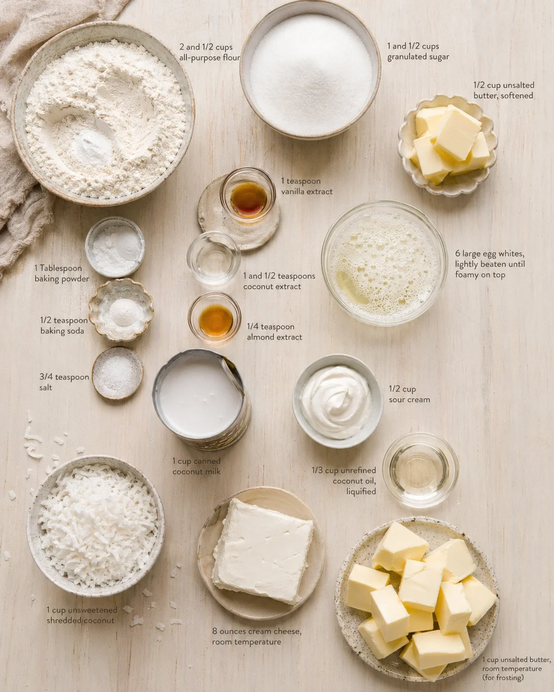 top-down flat lay of baking ingredients with labeled measurements on a wooden surface