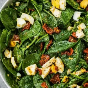 Measured ingredients arranged for Classic Spinach Salad: 10 oz baby spinach, 6 slices bacon - cooked and crumbled, 4 hard-boiled eggs - chopped, 3 Tbsp ketchup, 2 Tbsp honey - or granulated sugar, 2 Tbsp white vinegar