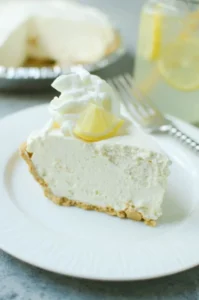 Frozen Lemonade Pie - only 4 ingredients and no bake! Graham cracker crust with a sweet creamy lemonade filling. The perfect summer dessert!