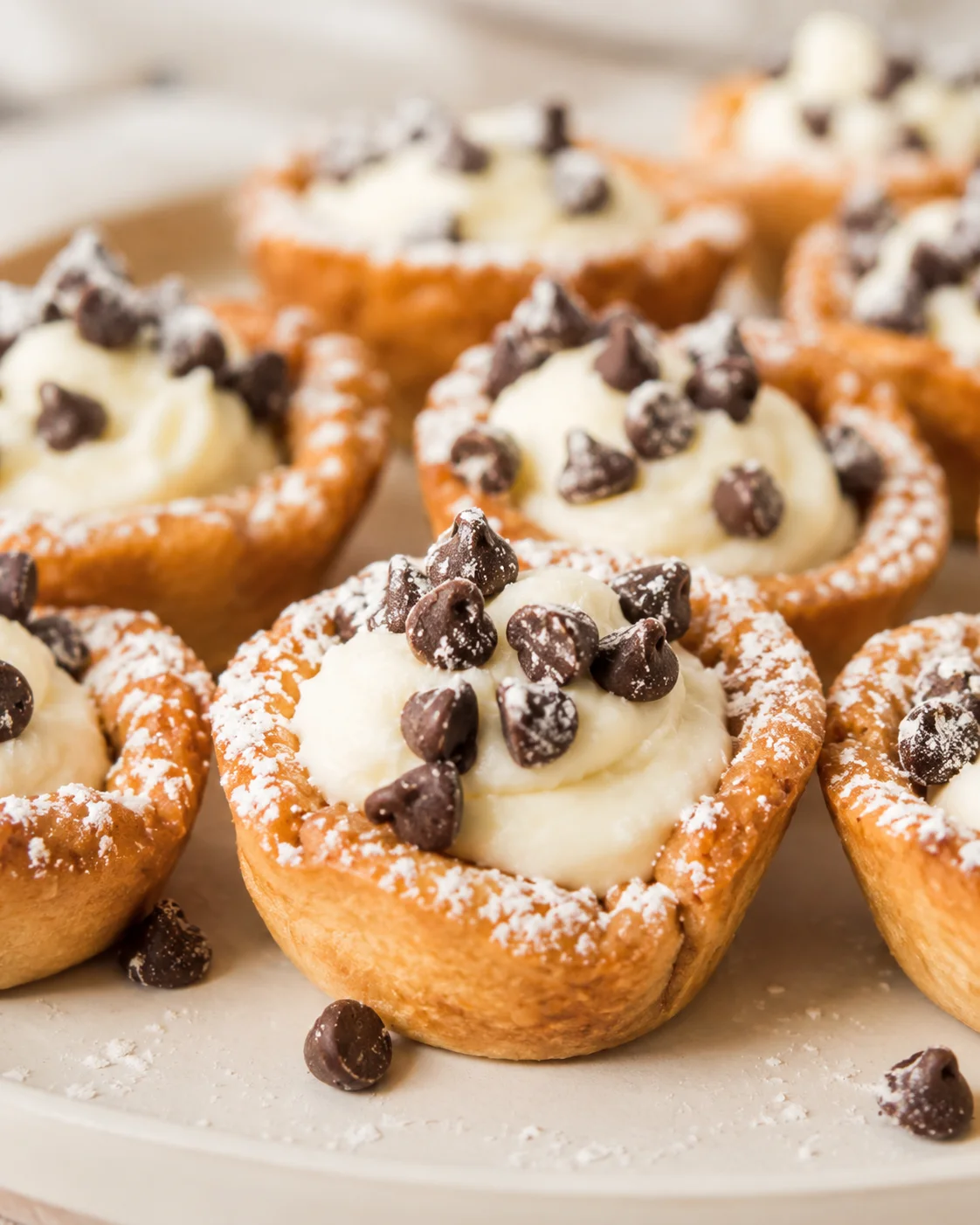 Close-up of delicious mini cannoli cups with cream and chocolate chips.