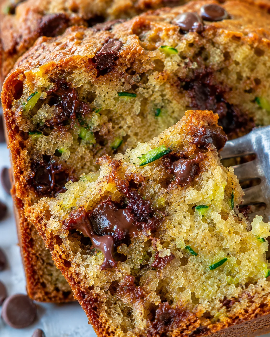 Close-up of moist zucchini bread with chocolate chips and nuts