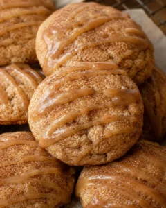 Close-up of soft, cinnamon-sugar coated apple butter snickerdoodles drizzled with glaze