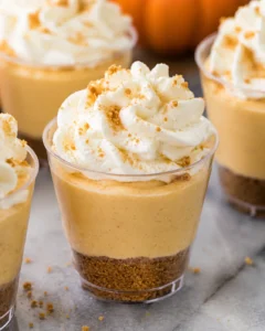 Delicious no-bake mini pumpkin pie cheesecakes with whipped cream topping