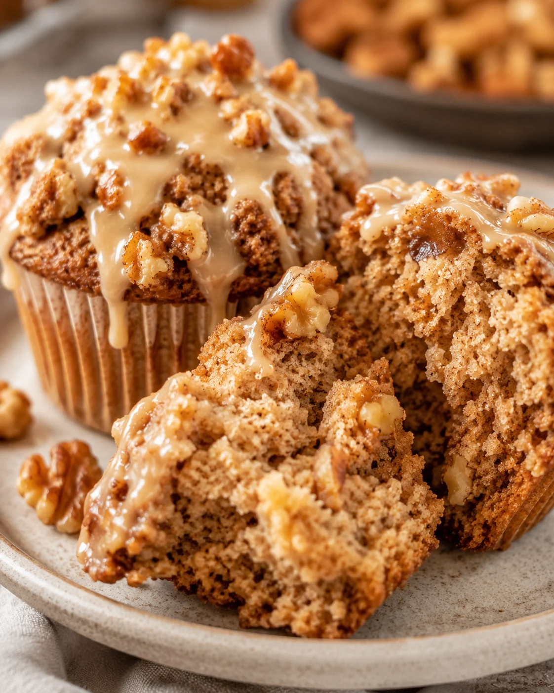 Close-up of delicious maple walnut muffins topped with maple glaze and streusel.