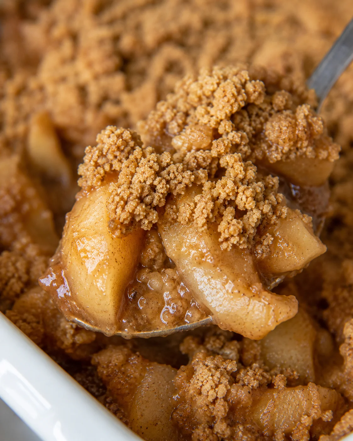 Close-up of warm pear crumble topped with cinnamon streusel.