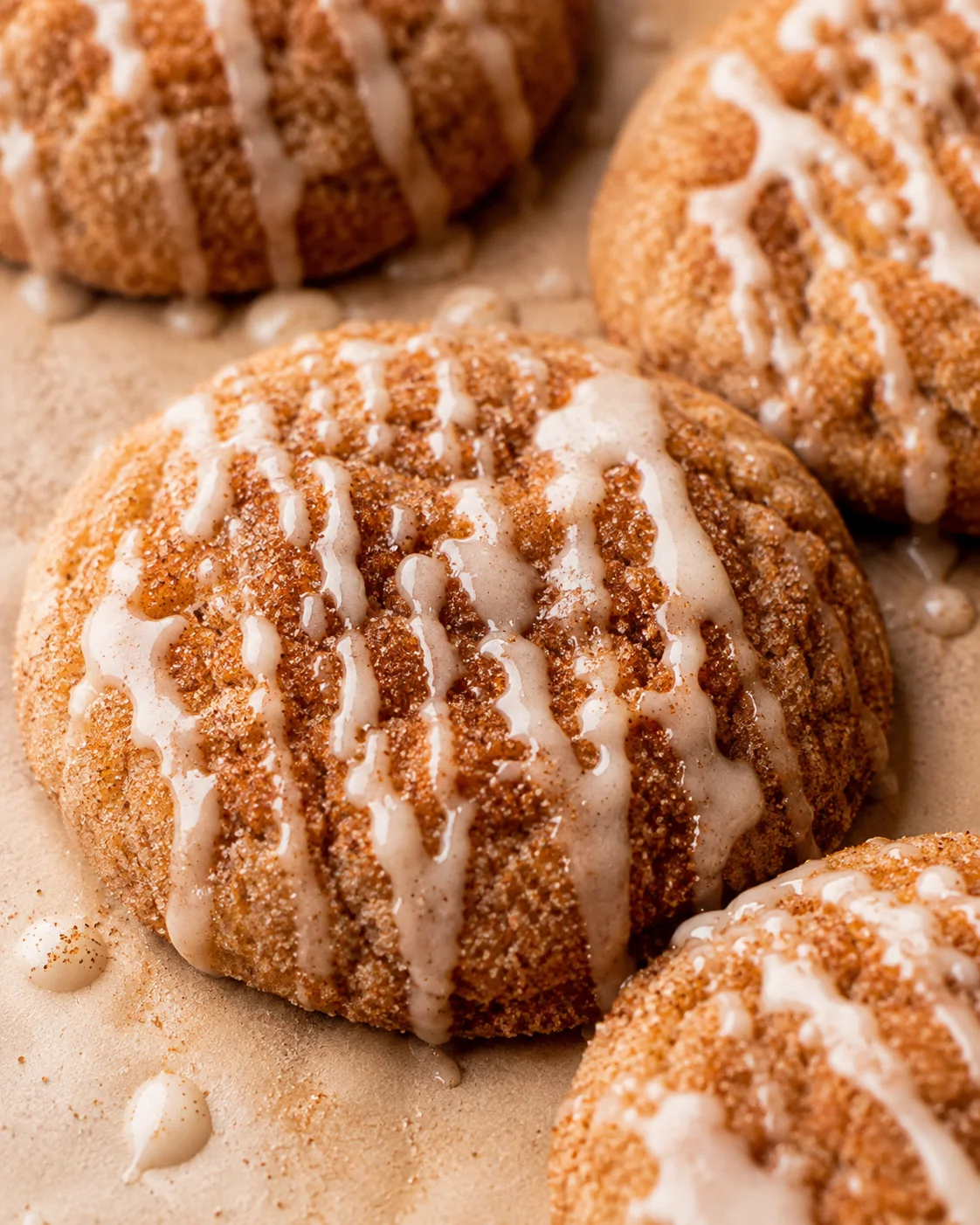 Close-up of apple cider cookies decorated with cinnamon sugar and white glaze